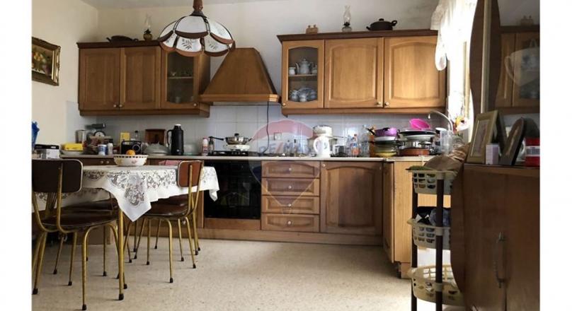 Unconverted older type apartment located in the village of Attard.
