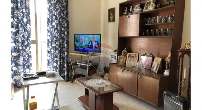 Unconverted older type apartment located in the village of Attard.