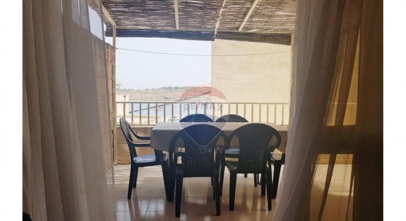 Qawra - Just a step away from the sea is this apartment with lovely sea views.