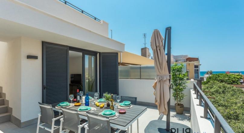 Sea view duplex apartment with roof terrace in El Molinar