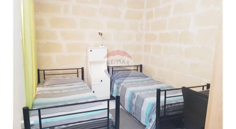 Qawra - Just a step away from the sea is this apartment with lovely sea views.