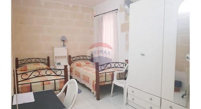 Qawra - Just a step away from the sea is this apartment with lovely sea views.
