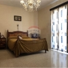 Unconverted older type apartment located in the village of Attard.