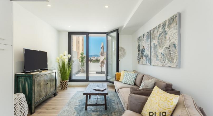 Sea view duplex apartment with roof terrace in El Molinar